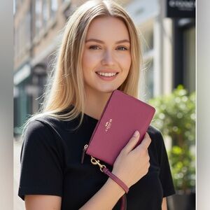 Coach primrose color pebbled leather wristlet. NWT perfect for summer & all year